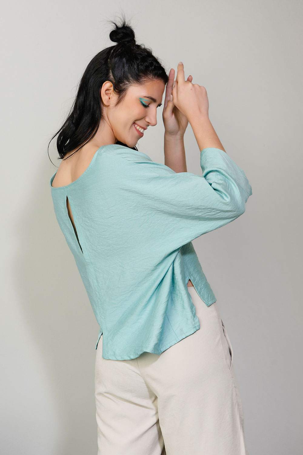 2. Blouse with asymmetries and openings teal 124225084